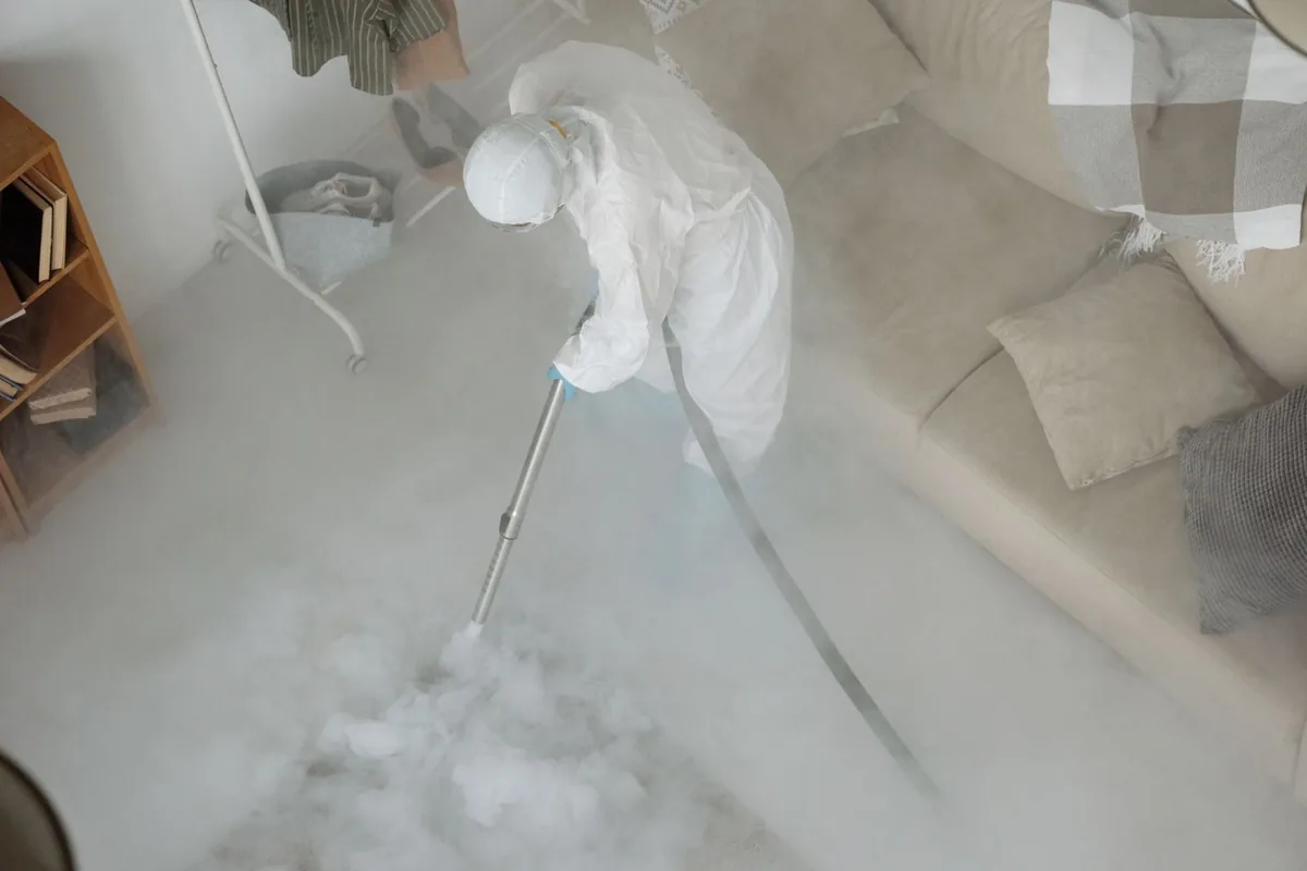 Biohazard cleanup technician in protective equipment, Bluewell, WV